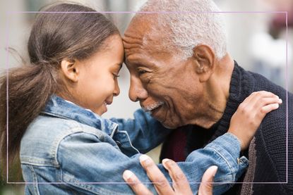 Grandfather hugging granddaughter 