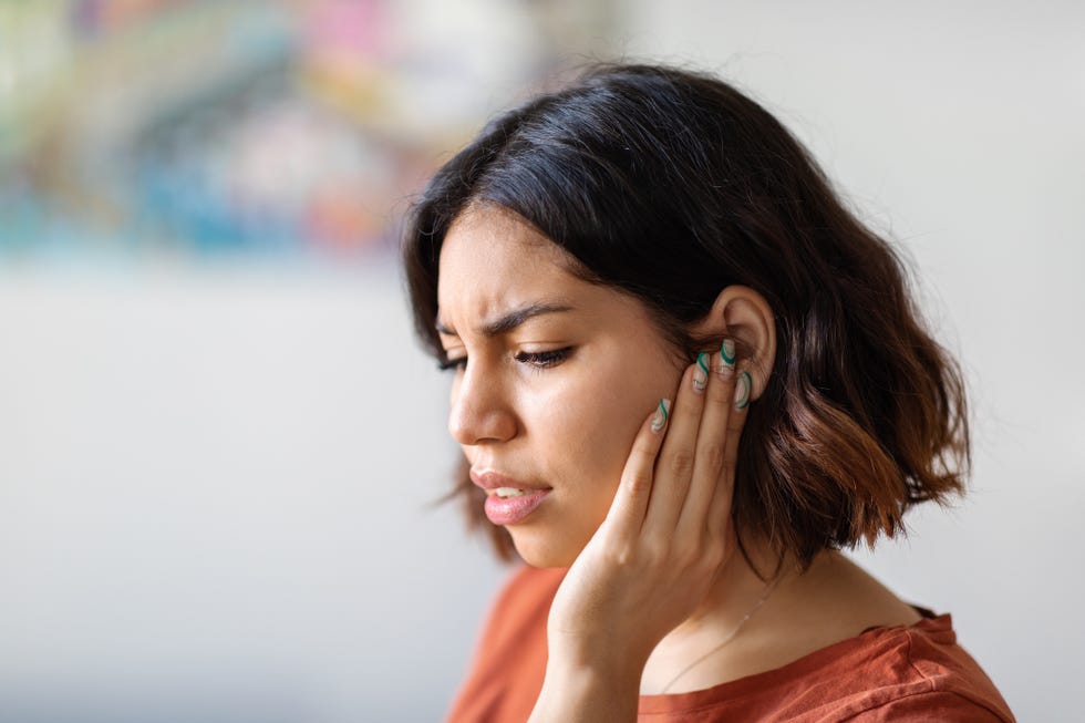 ears pain sick young arab woman suffering from earache at home