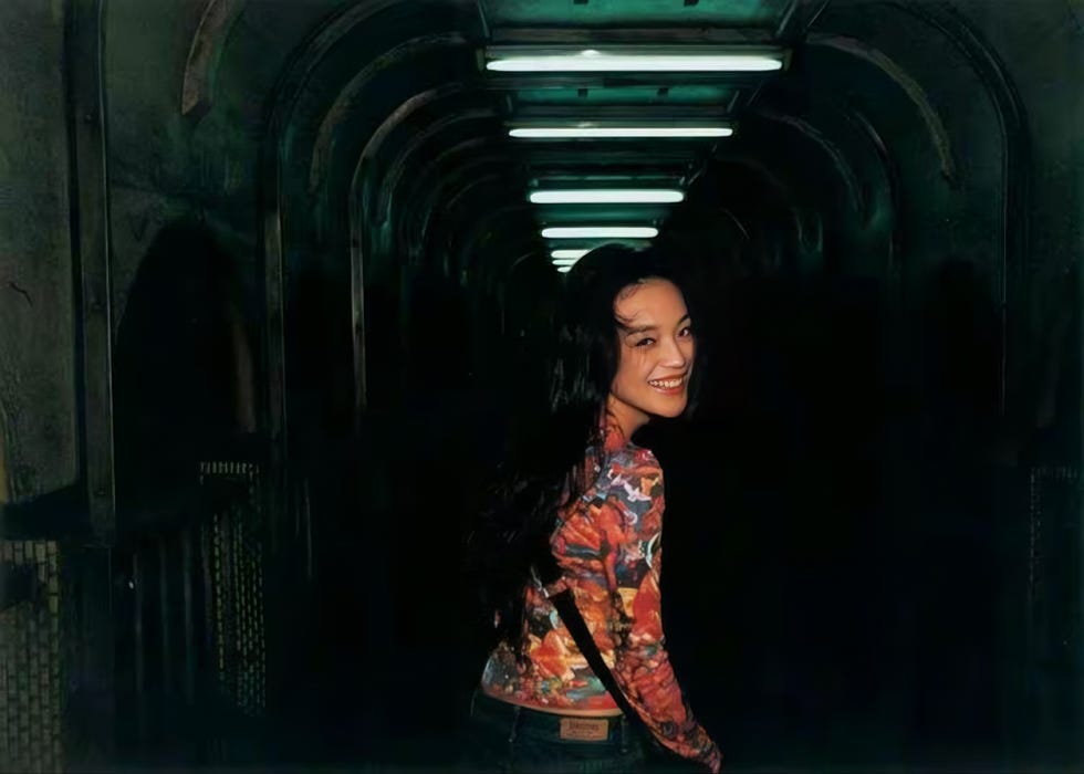 a person smiling in a tunnel