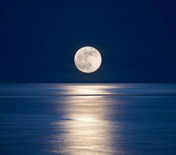 usa, seattle, san juan islands moonrise over salish sea