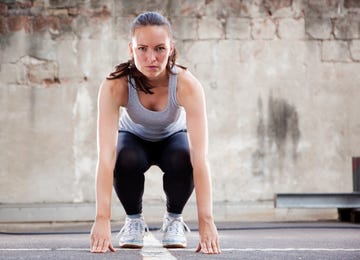 young woman doing burpee exercise