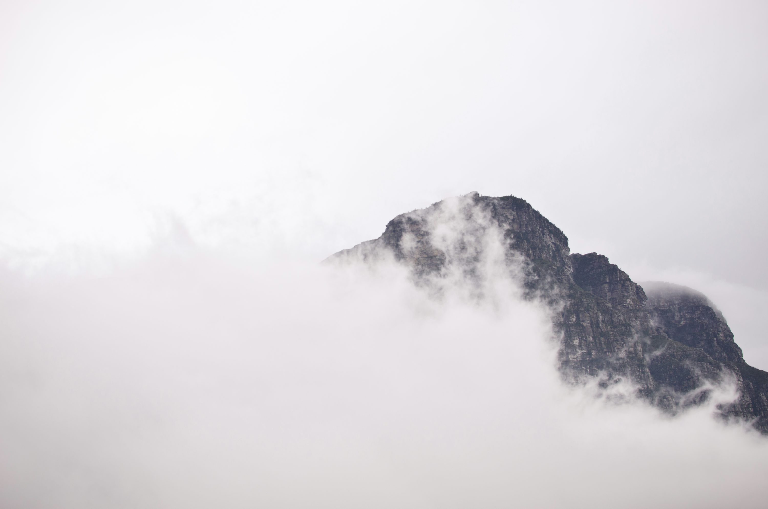 gray mountain covered by mountain