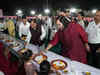 Mukesh Ambani and his son serve food to villagers in Gujarat as part of pre-wedding ritual. Check video and other details here