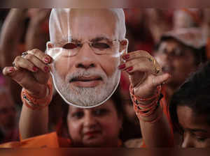 The Wider Image: Indian election casts spotlight on Modi look-alikes