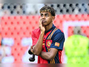 Spain's forward #19 Lamine Yamal looks on as he walks the pitch prior to the UEFA Euro 2024 Group B football match between Albania and Spain at the Duesseldorf Arena in Duesseldorf on June 24, 2024.