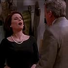 Megan Mullally and Tom Poston in Will & Grace (1998)