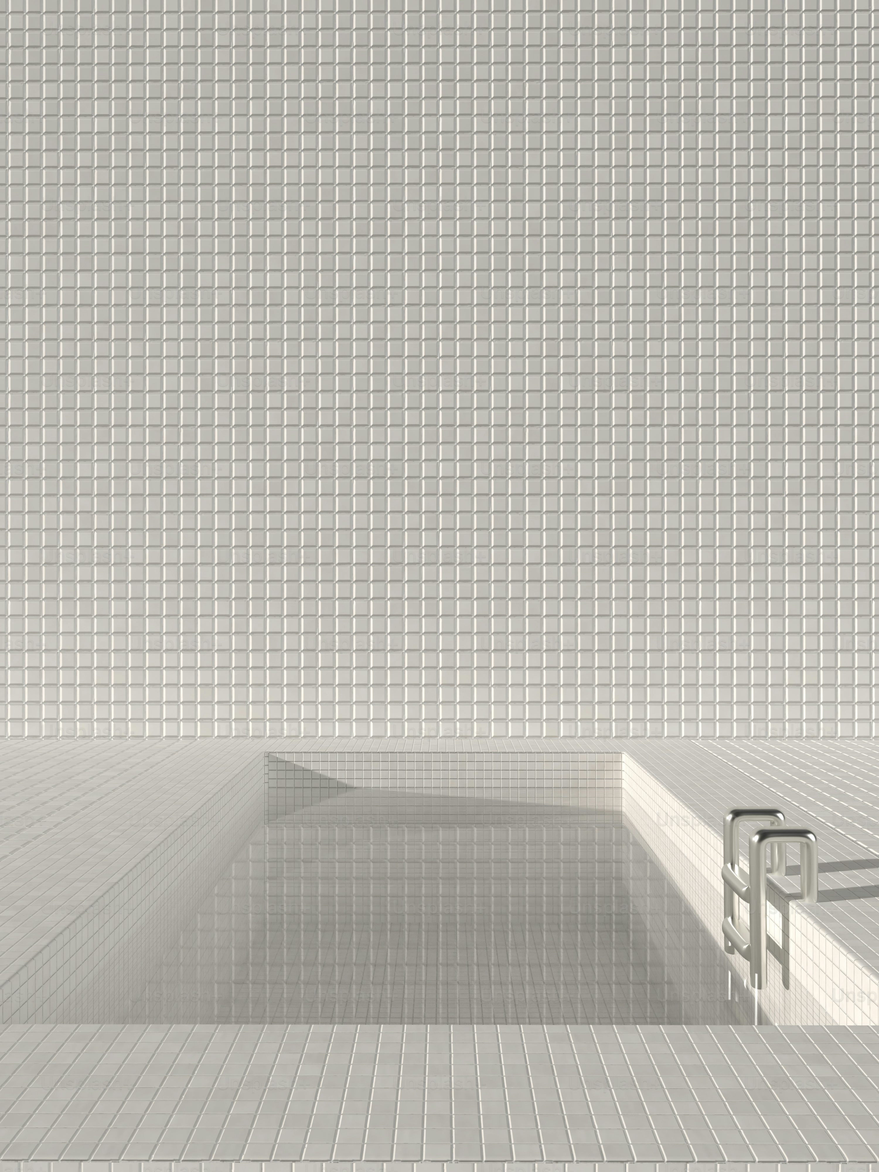 a white tiled bathroom with a sink and toilet