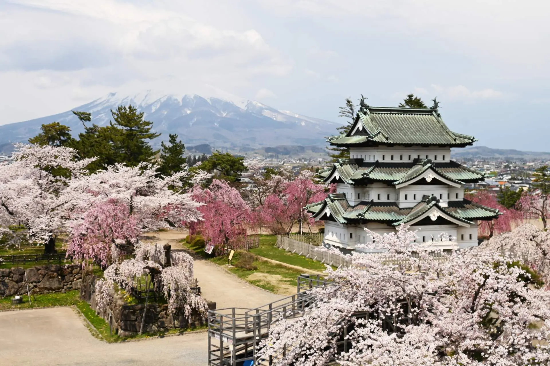 The castle, with Mount Iwaki in the background, is one of the twelve original castles still existing in Japan.