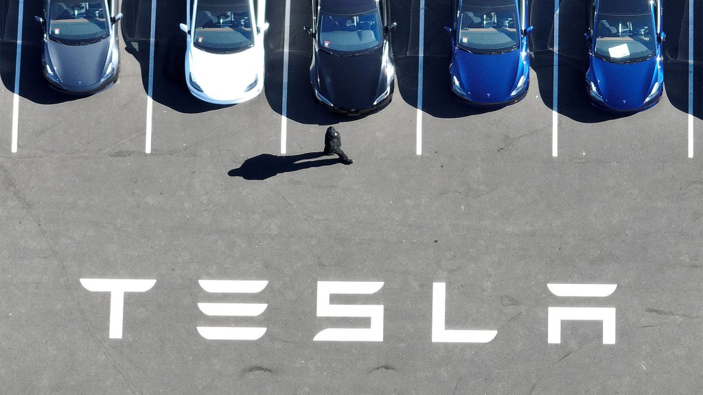 Tesla profits drop 55%, company says EV sales ‘under pressure’ from hybrids