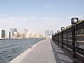 Sidewalk in Bur Dubai with Deira Twin Towers in the background