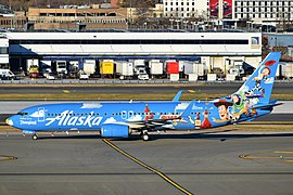 Alaska Airlines Boeing 737-890 N537AS (Friendship and Beyond at Disneyland Resort - Pixar Pier livery) at JFK Airport.jpg