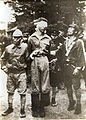 A captured American survivor of a shot-down B-29 crew is led from a village hall in Niigata, Japan in July, 1945.