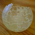 "Wikipedia_Globe_translucent_3D_printed_woodgrain_background.jpg" by User:Slashme