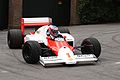 Button demonstrating the McLaren MP4/2C (1986) at the 2010 Goodwood Festival of Speed.