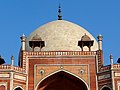 Details of the entrance iwan, and white marble dome and chhatris or kiosks on the roof of Humayun's tomb.