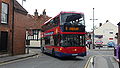 English: Wilts & Dorset 1133 (HF09 BJJ), a Scania OmniCity, turning from Salt Lane into Rollestone Street, Salisbury, Wiltshire, on the Activ8 service.