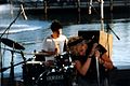 Linda Hopper (singer) and Mark Posgay (drummer) performing with Magnapop at an outdoor gig in Providence, Rhode Island, United States on 1996-08-08