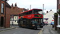 English: Wilts & Dorset 3155 (R155 NPR), a DAF DB250/Optare Spectra, turning from Salt Lane into Rollestone Street, Salisbury, Wiltshire, on the Stonehenge Tour. It is wearing the new livery for the service.