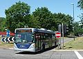 English: Metrobus 578 (YT09 BKV), a Scania OmniCity, in Crawley, West Sussex, on route 10, driving out of the bus lane over the middle of Tushmore Roundabout.
