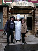 Paul Bocuse mit deutschen Gästen vor dem drei Sterne Restaurant Paul Bocuse alias L’Auberge du Pont de Collonges, 2001.jpg