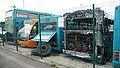 English: The Arriva The Shires High Wycombe depot. It was opened in 2005, and is situated in Lincoln Road, Cressex Industrial Estate, High Wycombe, Buckinghamshire. This photograph shows "death row", a line of withdrawn, accident damaged, sold or otherwise dead buses. Note the fire victim.