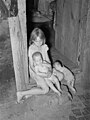 Children of agricultural day laborer in doorway of home near Tullahassee, Oklahoma, June 1939