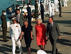 President George Bush, right, and his wife, Barbara, are accompanied by Adm. Charles R. Larson, commander-in-chief, U.S. Pacific Command, and his wife as they arrive at the Kilo 8 P - DPLA - 20fdda42ac1d52f4513eeec695167185.jpeg