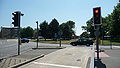 English: A piece of bus lane, over the middle of Tushmore Roundabout in Crawley, West Sussex, helping buses get past other traffic. Seen here is the end of a stretch of guided busway, that leads up to the roundabout's northern side, and Fastway buses are able to drive over the middle to the southern side. Tushmore Roundabout is at the junction of the A23 road, and the A2011 and A2219. This is part of the Crawley Fastway guided bus system.