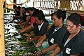 Sorting bananas and slicing them from bunches