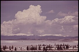 Thunderclouds over grassy plateau, 05-1972. (7065644559).jpg