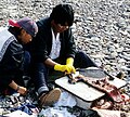 Inuit preparing fur of bearded seal (Erignathus barbatus) for clothing; Baffin Island near Foxe Basin (Nunavut, Canada)