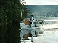 Steam ship S/S Engelbrekt on its way down on the Österdal river to Leksand an evening in August Author: Mashavet