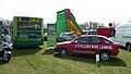 A display for Southern Vectis' Scrap my Motor scheme, offering free bus travel if you scrap your car. It features the back of bus 301 Chilton Chine (HW54 BTU), a Dennis Dart SLF/Plaxton Pointer MPD, which (as is visible) features a rear advert for the scheme, as well as crew car 096 (P518 VTX), a Ford Escort MkVI.}}