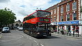 English: Wilts & Dorset 3154 (R154 NPR), a DAF DB250/Optare Spectra, in Blue Boar Row, Salisbury, Wiltshire, on the Stonehenge Tour. It is wearing the new livery for the service.