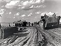 A column of Alligators passing Terrapin amphibious vehicles on the Scheldt River near Terneuzen, 13/10/1944.