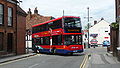 English: Wilts & Dorset 1135 (HF09 BJO), a Scania OmniCity, turning from Salt Lane into Rollestone Street, Salisbury, Wiltshire, running out of service.