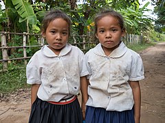 Twin sisters wearing school uniform in Si Phan Don.jpg