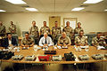 Powell and other officials pose for a group photograph prior to discussing U.S. military intervention in the Persian Gulf during Operation Desert Shield.