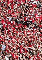 Fans doing the Guns Up hand sign