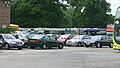 English: The First Berkshire & The Thames Valley bus depot in Bracknell, off Market Street, Bracknell, Berkshire. Visible are a Green Line Volvo, a Ride Pegasus Dennis Dart visiting from Merrow outstation in Guildford (where First run the Ride Pegasus buses for Surrey County Council from), and the back of an American-style school bus that seems to float around First. Other standard First buses are also visible. Please note the photo was taken from outside the company premises, from the entrance of the depot.