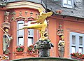 2009-07-11 #00880 Gilded bronze sculpture „Imperial Eagle” on top of romanesque market fountain on medieval market square in historic town of Goslar