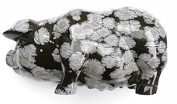 Pig carved in snowflake obsidian, 10 centimeters (4 in) long. The markings are spherulites.