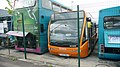 English: Arriva The Shires 5118 (G288 UMJ) (left), a Leyland-bodied Leyland Olympian, and (right) 2402 (YJ57 EKG), an Optare Versa, at Arriva's depot in Cressex Industrial Estate, High Wycombe, Buckinghamshire. Both are parked on "death row" at the depot, for buses with problems. 5118, being a rather elderly double-decker, has probably with withdrawn due to its age, and has since gone for scrap. 2402 looked OK, so presumably was either just parked there or has something mechaniacally wrong with it.