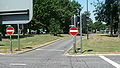 English: A piece of bus lane, over the middle of Tushmore Roundabout in Crawley, helping buses get past other traffic. A stretch of guided busway leads up to its northern side, and Fastway buses are able to drive over the middle to the southern side. Tushmore Roundabout is at the junction of the A23 road, and the A2011 and A2219. This is part of the Crawley Fastway guided bus system.