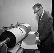 Charles Richter analyzing a seismograph log.jpg