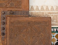 Stucco, wooden door, mosaics, wall Alhambra, Granada, Spain.jpg