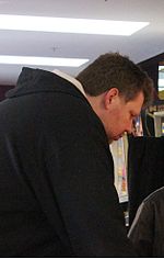 Thumbnail for File:Todd MacCulloch playing pinball cropped.jpg