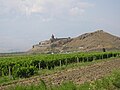 A distant view to Khor Virap monastery with Mount Ararat visible in the mist at the left