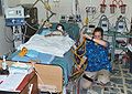 Nurse at the bedside of a young boy in an Intensive Care Unit, IBN Sina Hospital, Baghdad, Iraq (April 2004).