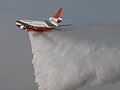 Tanker 910 performing a demonstration water drop